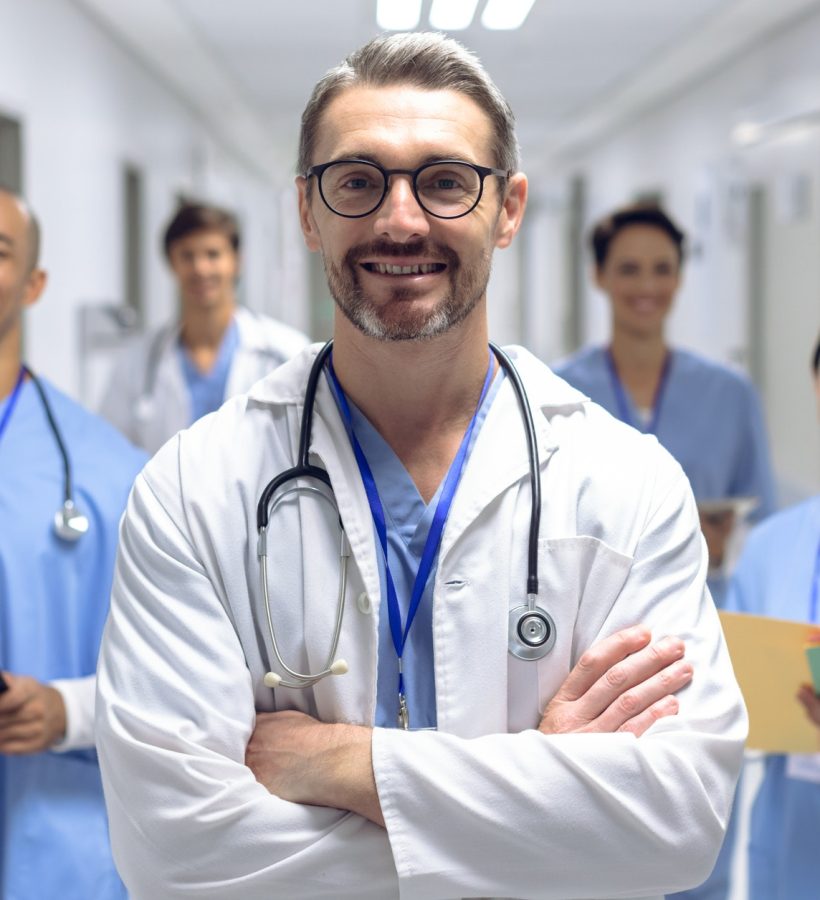 diverse-medical-team-of-doctors-looking-at-camera-while-holding-clipboard-and-medical-files.jpg